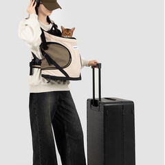 travel-front-pet-backpack-carrier-with-luggage, Woman standing with rolling suitcase, wearing front carry pet backpack carrier, cat inside, portable travel pet front bag