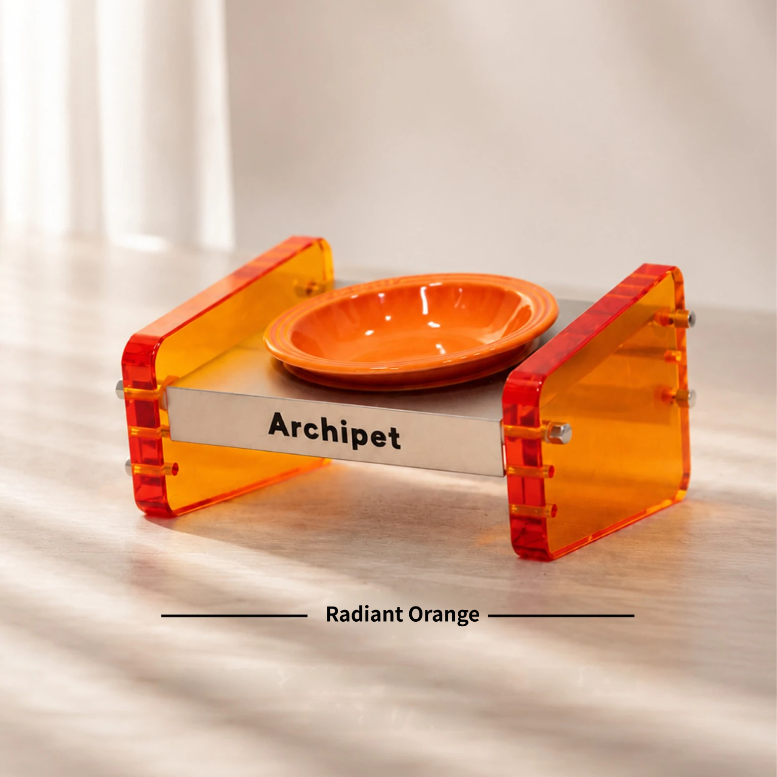 Archipet Radiant Orange translucent acrylic cat bowl stand, bright orange ceramic pet bowl, adjustable raised feeder on wood surface, modern stylish pet furniture