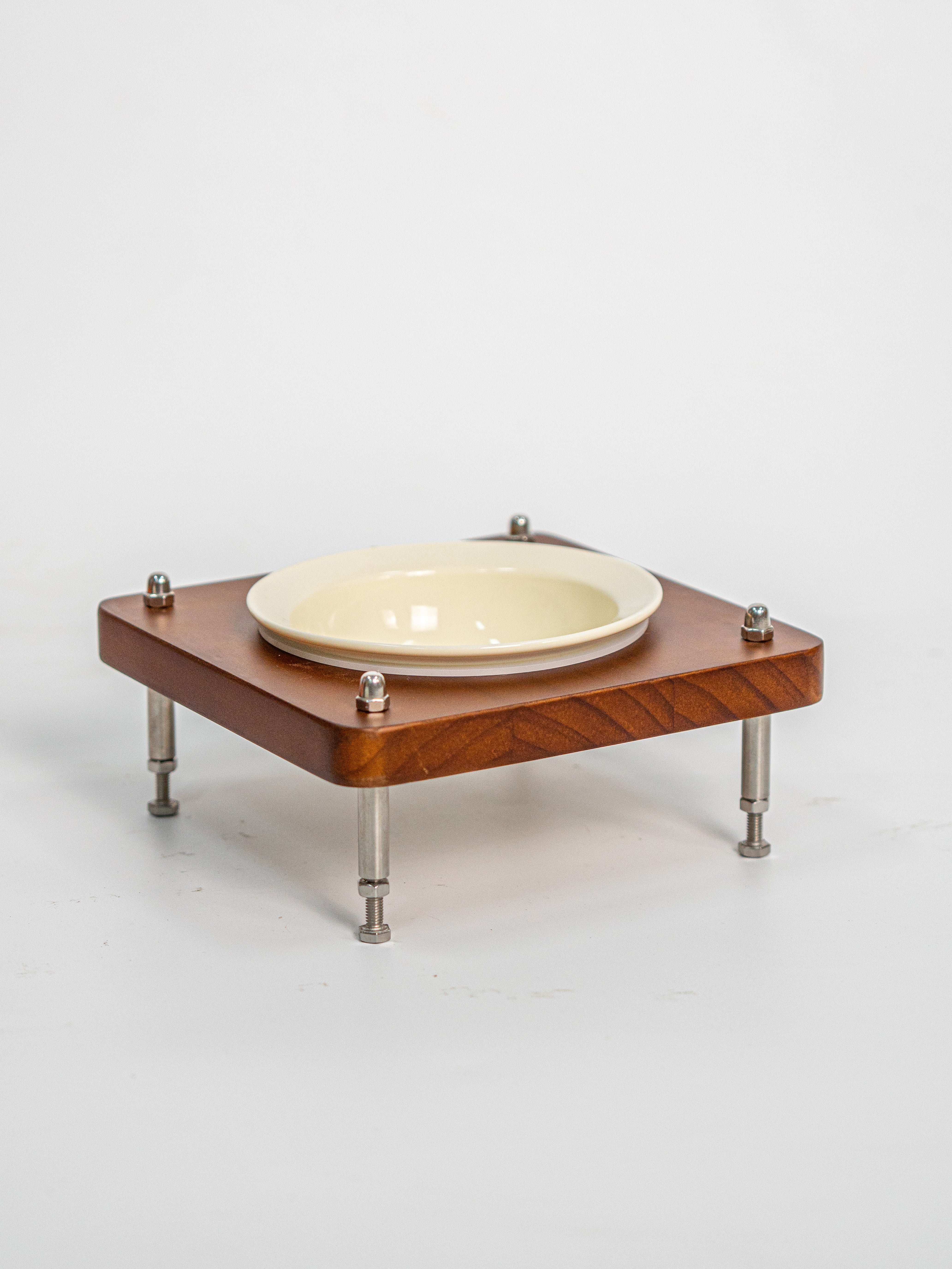 Vintage wooden elevated cat bowl with cream ceramic dish, height adjustable stainless steel legs, non‑slip silicone ring, ergonomic raised pet feeder for cats.