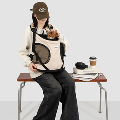 ront-carry-pet-backpack-carrier-beige-khaki-cat, Woman sitting on bench wearing front carry pet backpack carrier, cat peeking out, breathable mesh pet front carrier for cats and small dogs