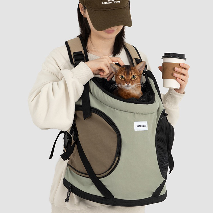 green-khaki-front-pet-backpack-carrier-coffee, Woman holding coffee cup with sage green khaki front carry pet backpack carrier, cat inside, breathable pet travel front bag